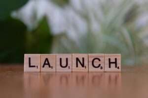 A scrabble block spelling out the word launch